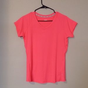 Sports wear top,  neon orange Medium size, Hyba brand.